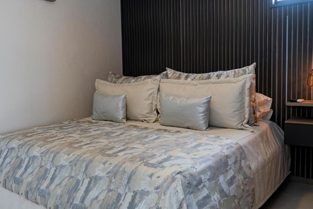 Postel nebo postele na pokoji v ubytování Apartamentos Gema Lujosos en Laureles