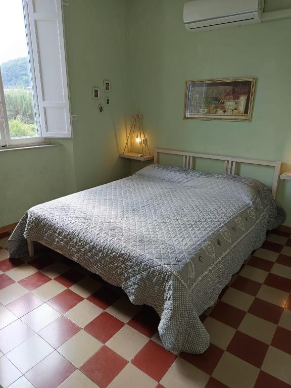 Postel nebo postele na pokoji v ubytování L'Acero Rosso