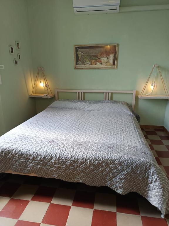 Postel nebo postele na pokoji v ubytování L'Acero Rosso