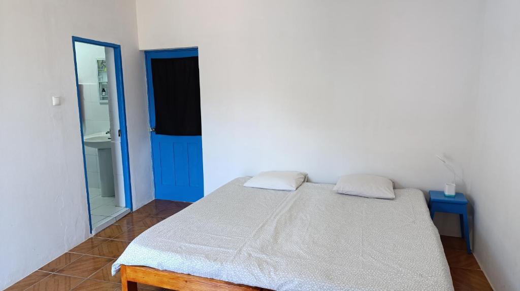 Postel nebo postele na pokoji v ubytování Oiá Paúl