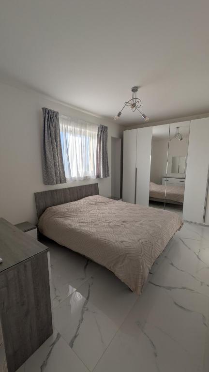Postel nebo postele na pokoji v ubytování Ramla Valley View Gozo Apartment