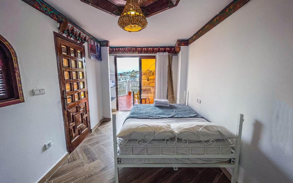 Una cama o camas en una habitación de Tangiers Hostel