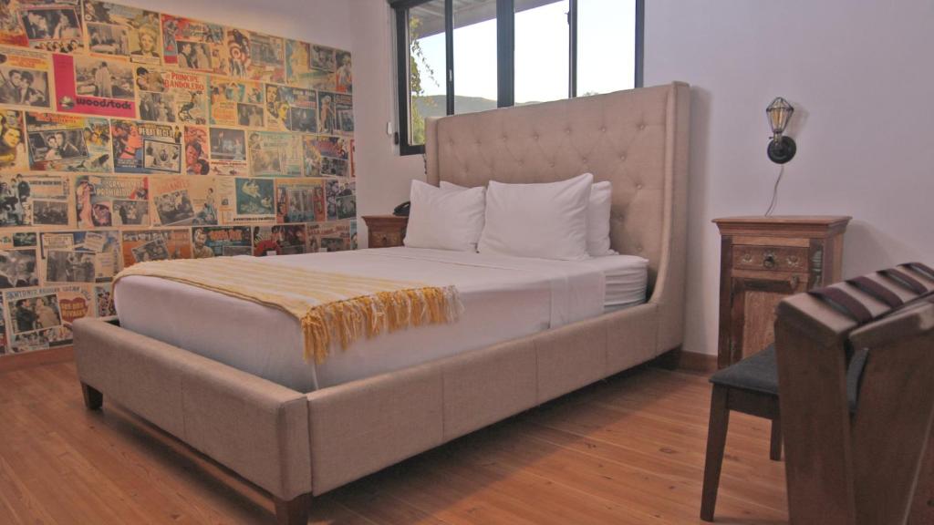 Ένα ή περισσότερα κρεβάτια σε δωμάτιο στο L86 Hotel Boutique y Eventos