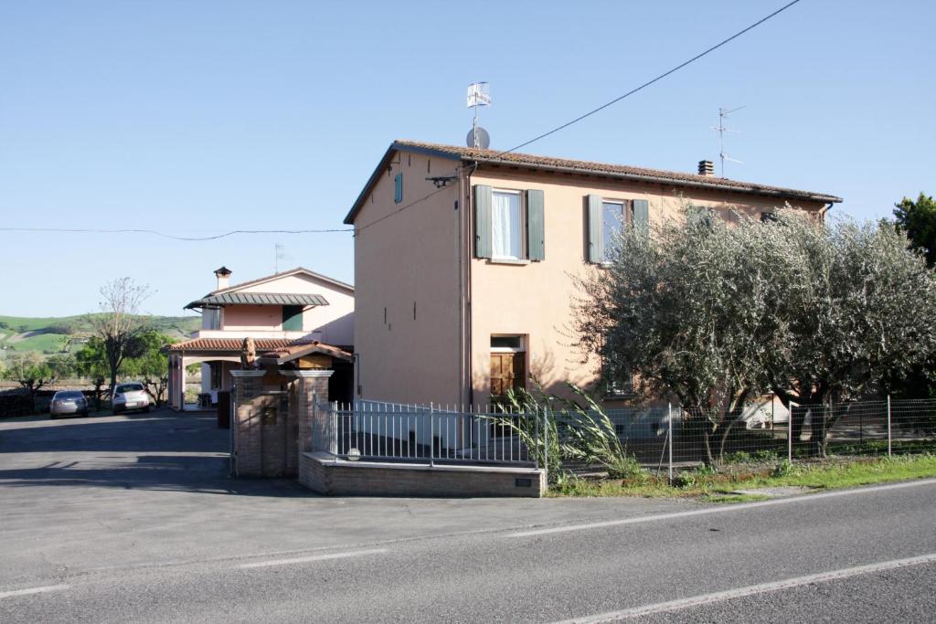 a house sitting on the side of a street at La Casa della Nonna in Brisighella