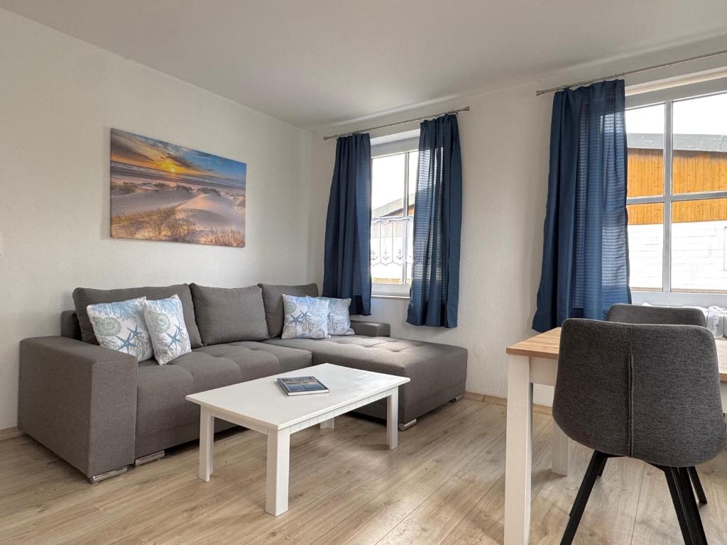 Et opholdsområde på Bensersiel Ferienwohnung Pirat mit Terrasse