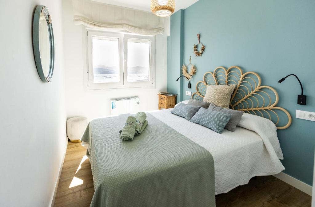 Letto o letti in una camera di Covelodge - Piso a pocos metros de la playa