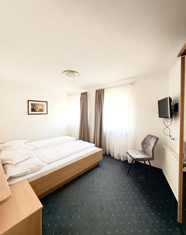 Postel nebo postele na pokoji v ubytování Garni Hotel Dorothea
