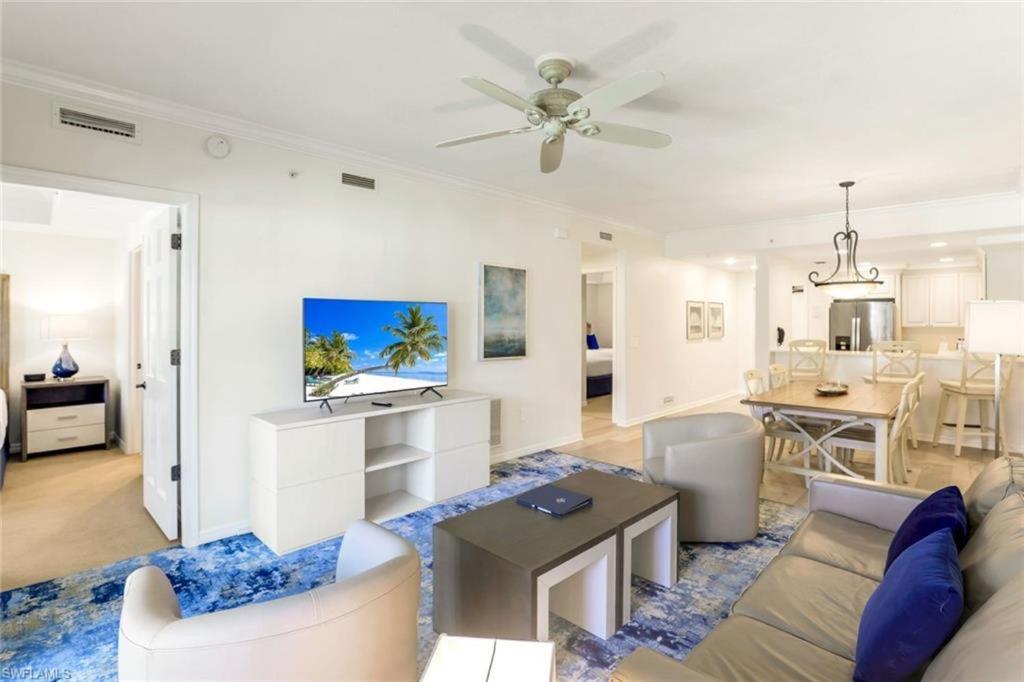 a living room with a couch and a table at Bellasera Resort in Naples