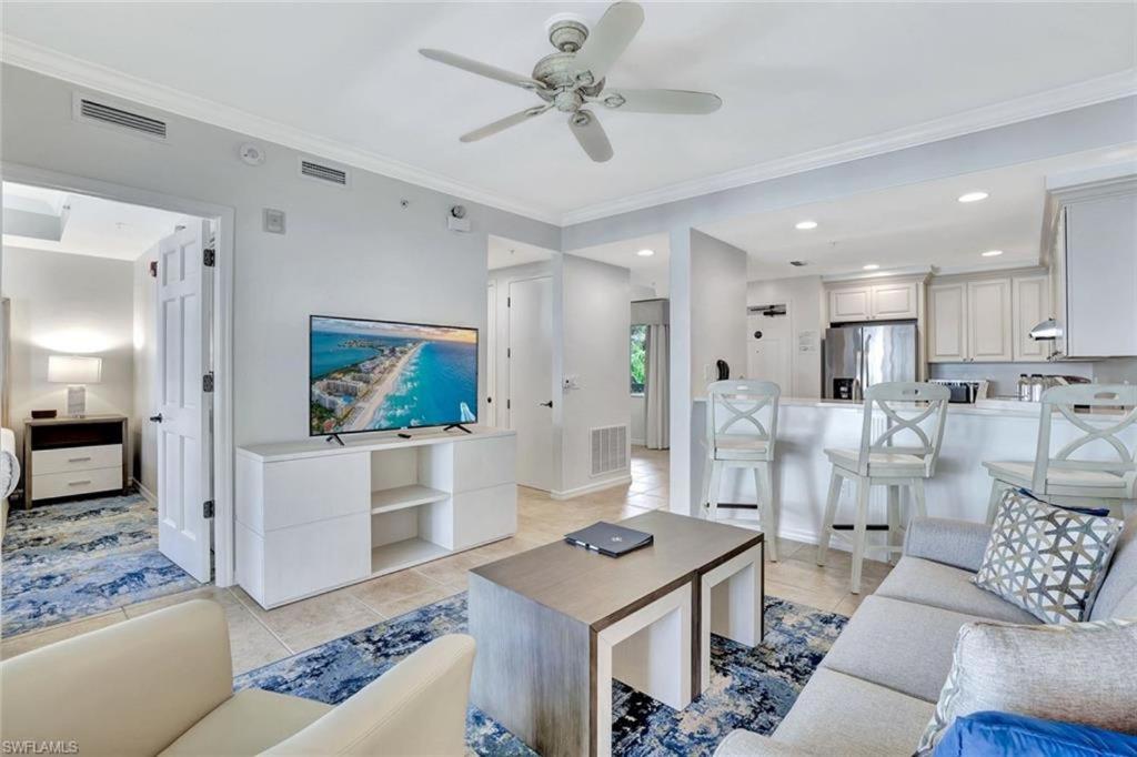 a living room with a couch and a table at Bellasera Resort in Naples