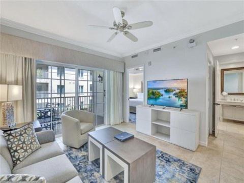 a living room with a couch and a table at Bellasera Resort in Naples