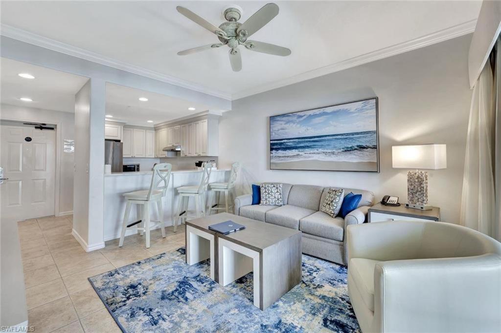 a living room with a couch and a table at Bellasera Resort in Naples