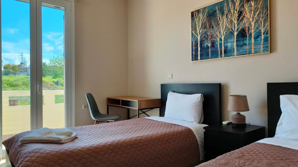A bed or beds in a room at Pazinos/Neveli Cottage