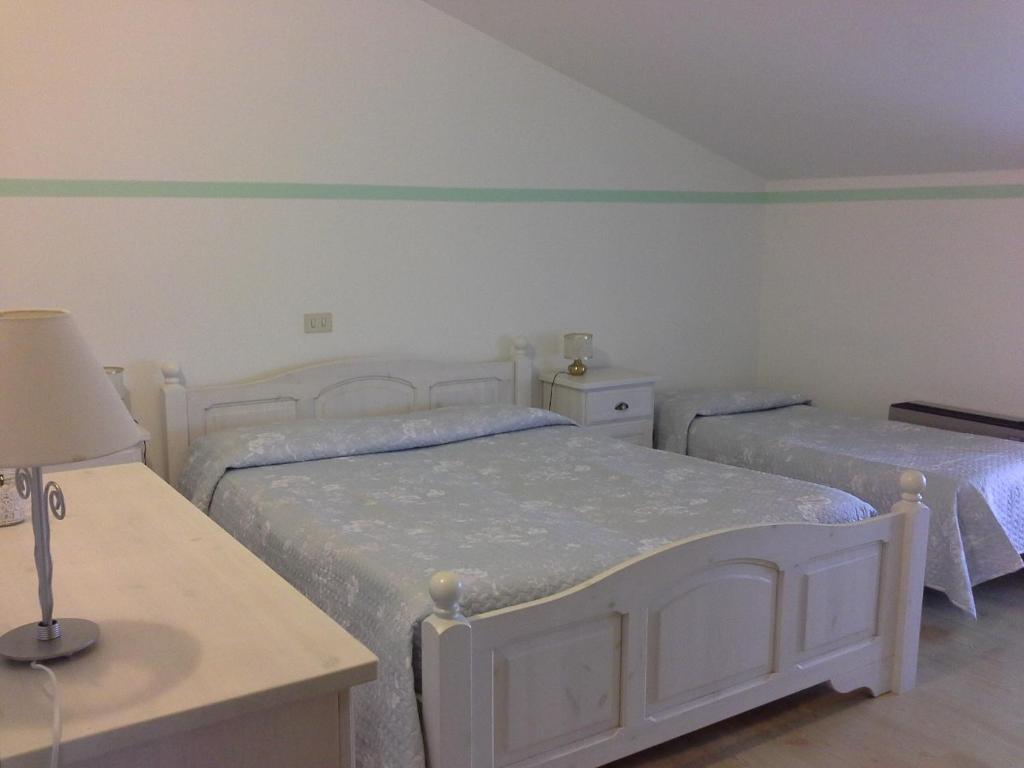 Postel nebo postele na pokoji v ubytování Hotel La Rama