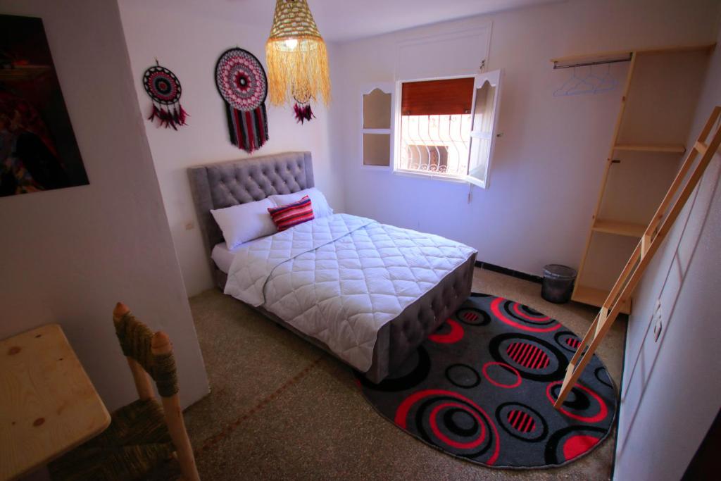 Postel nebo postele na pokoji v ubytování Jurassic Surf House Anza