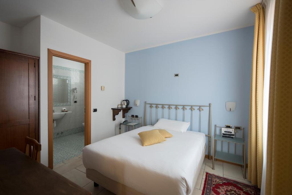 Posteľ alebo postele v izbe v ubytovaní Hotel Villa Colico