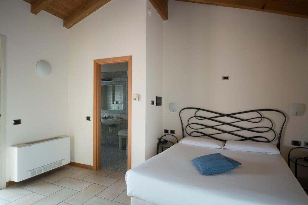 Posteľ alebo postele v izbe v ubytovaní Hotel Villa Colico