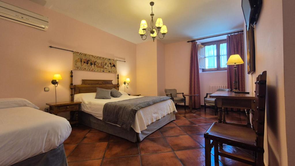 Postel nebo postele na pokoji v ubytování Hotel Las Cancelas