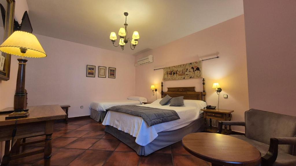 Postel nebo postele na pokoji v ubytování Hotel Las Cancelas