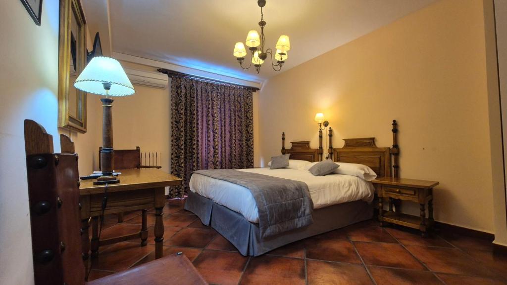 Postel nebo postele na pokoji v ubytování Hotel Las Cancelas