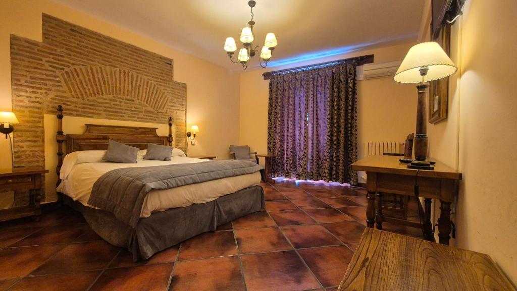 Postel nebo postele na pokoji v ubytování Hotel Las Cancelas