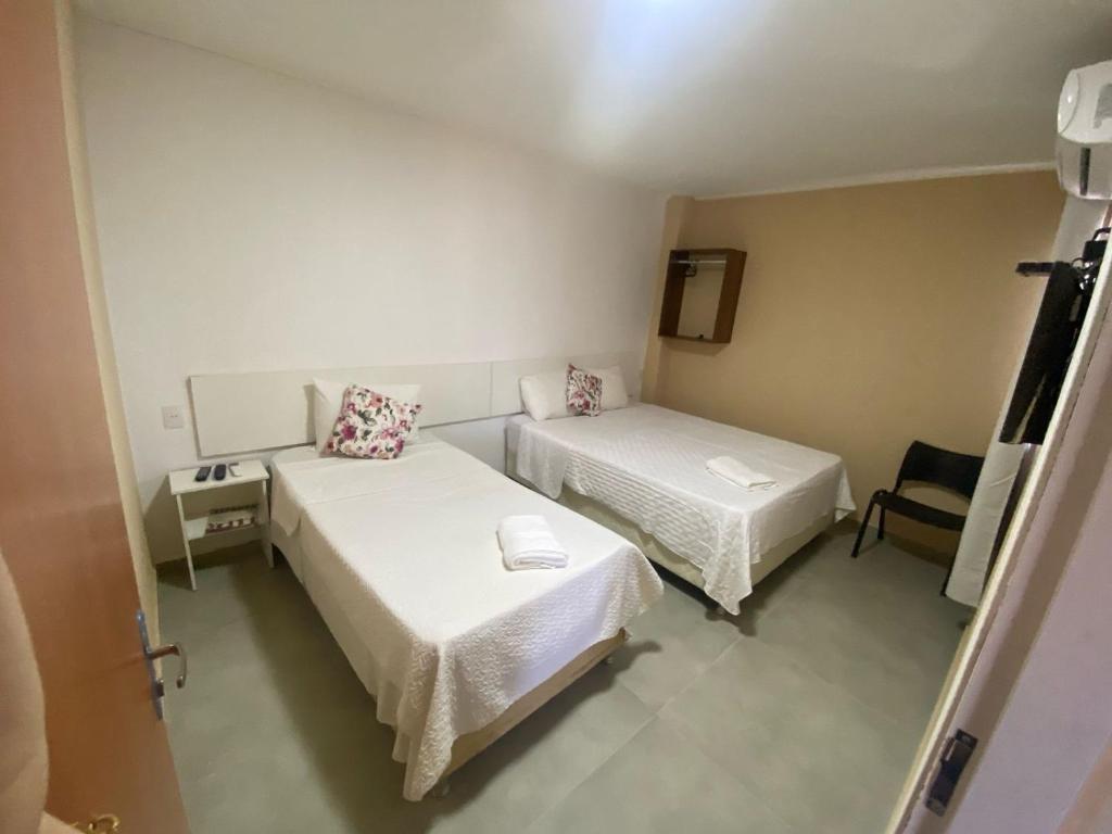 Postel nebo postele na pokoji v ubytování Hotel Sur Brasil