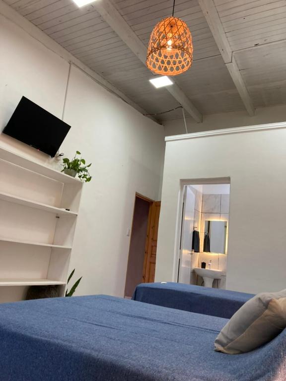 TV a/nebo společenská místnost v ubytování Posada El Ceibo