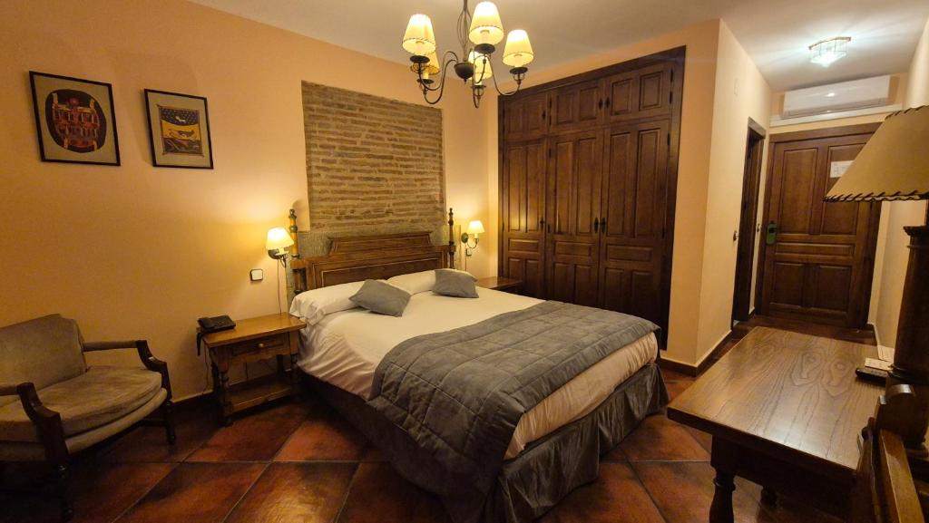 Postel nebo postele na pokoji v ubytování Hotel Las Cancelas