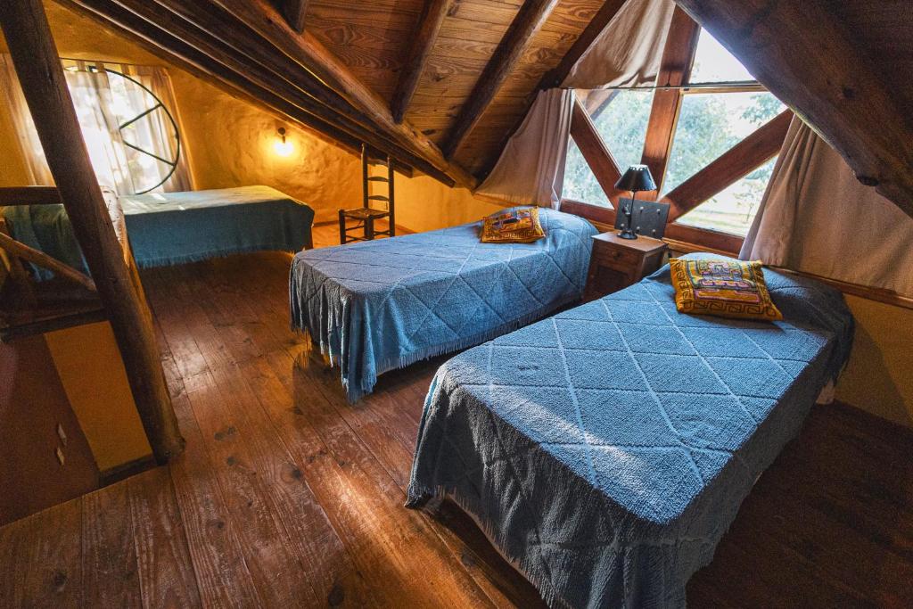 Postel nebo postele na pokoji v ubytování Algarrobo Luz Cabañas