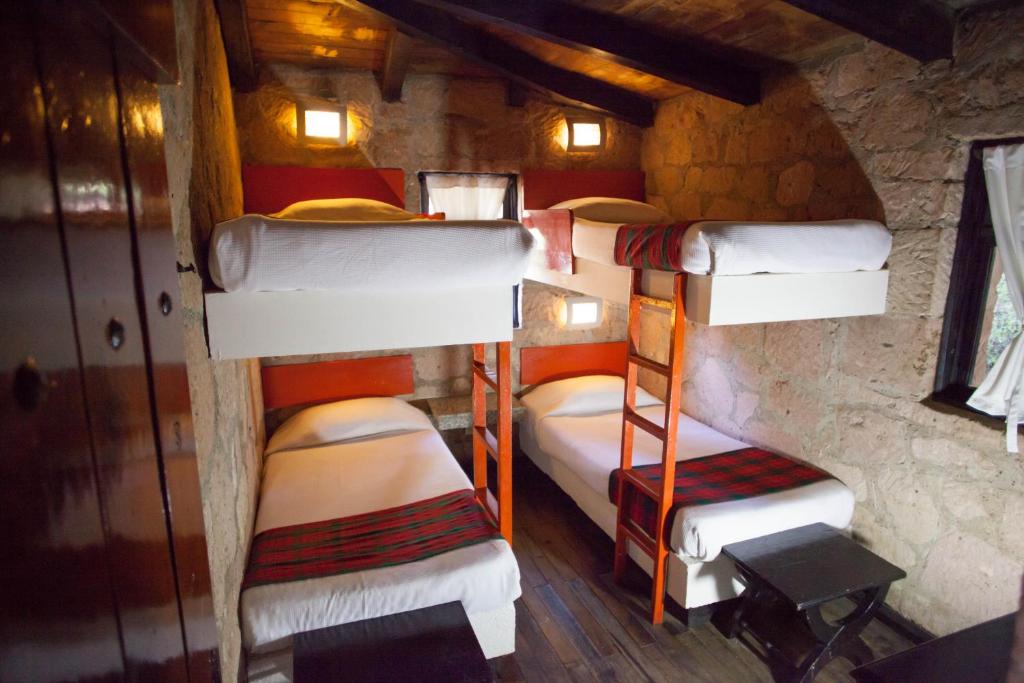 Postel nebo postele na pokoji v ubytování Monteverde