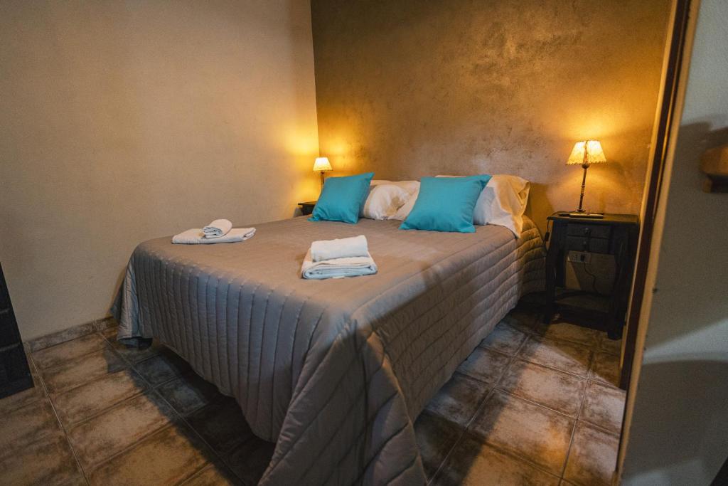 Postel nebo postele na pokoji v ubytování Algarrobo Luz Cabañas