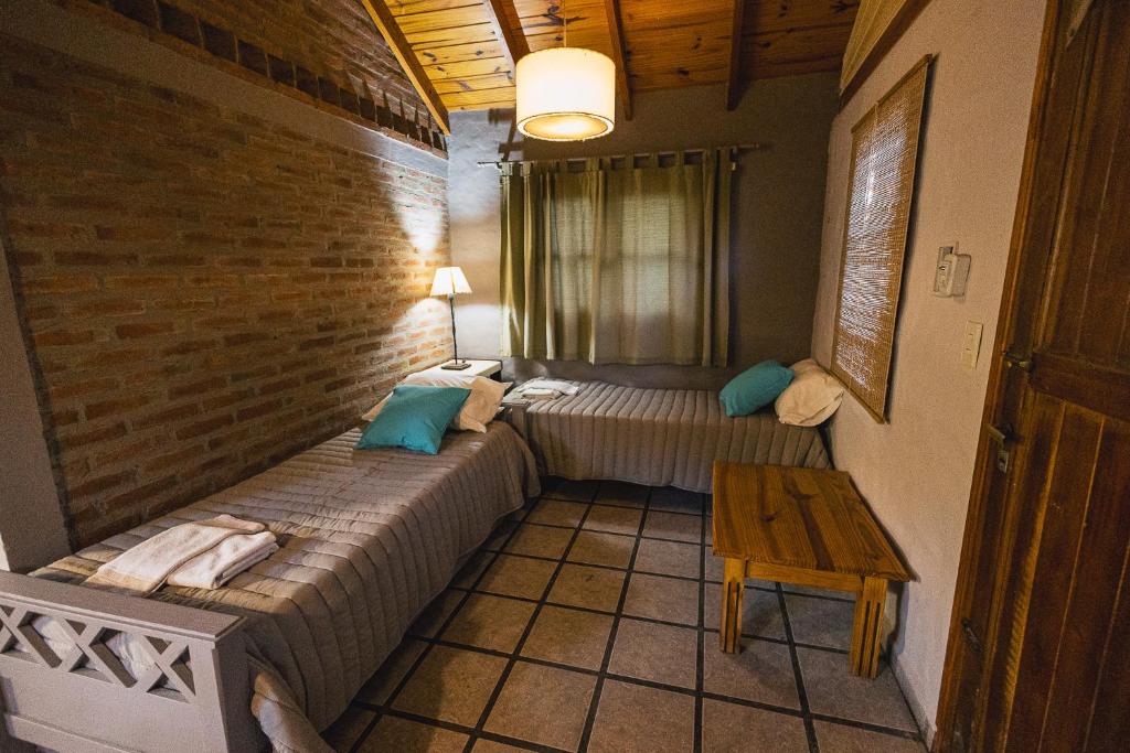 Postel nebo postele na pokoji v ubytování Algarrobo Luz Cabañas