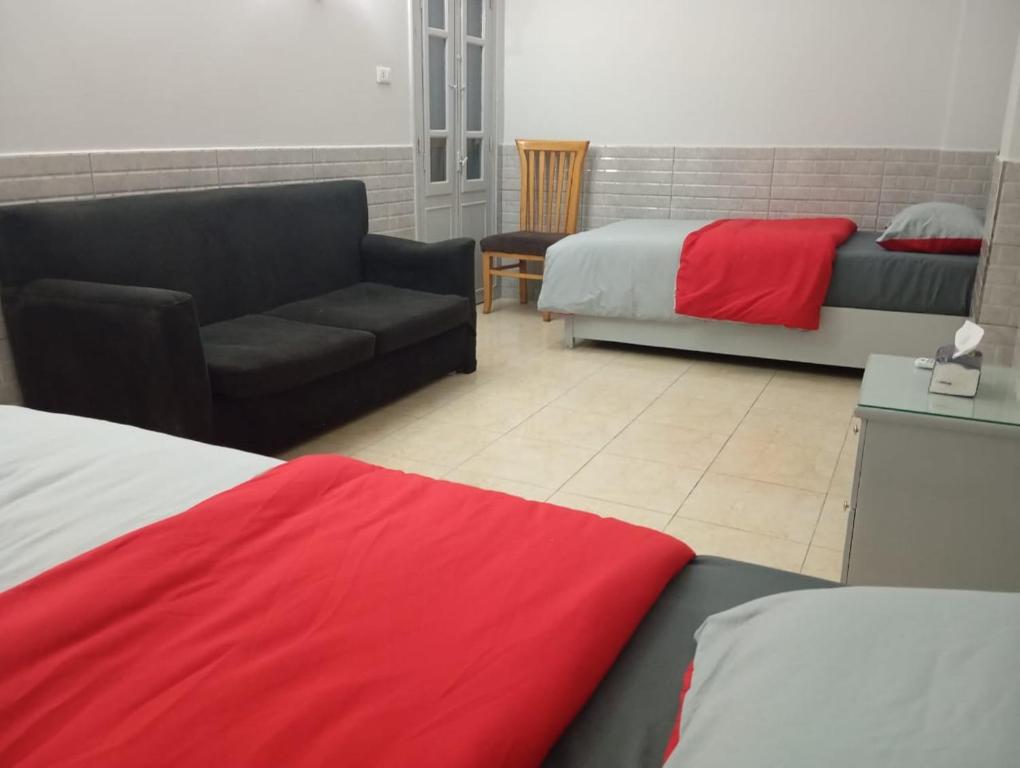 Postel nebo postele na pokoji v ubytování Abeer Guest House