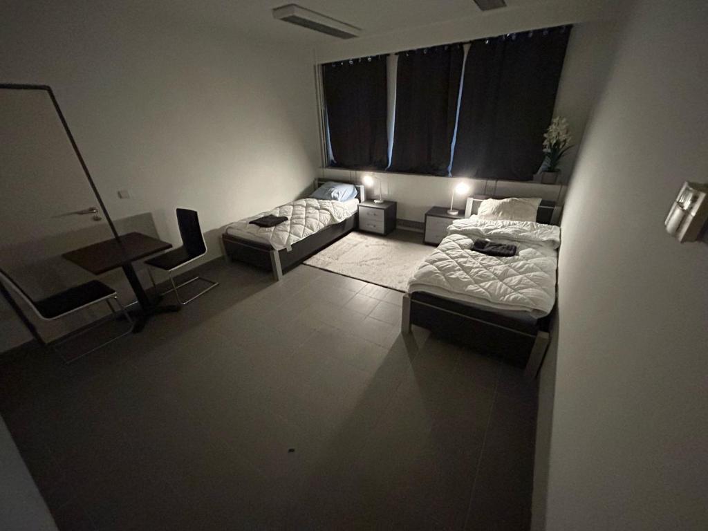 Postel nebo postele na pokoji v ubytování Rooms Exit E40