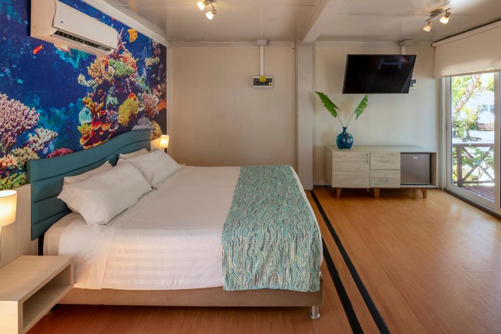 Cama ou camas em um quarto em Hotel Reina del Mar By Dorado