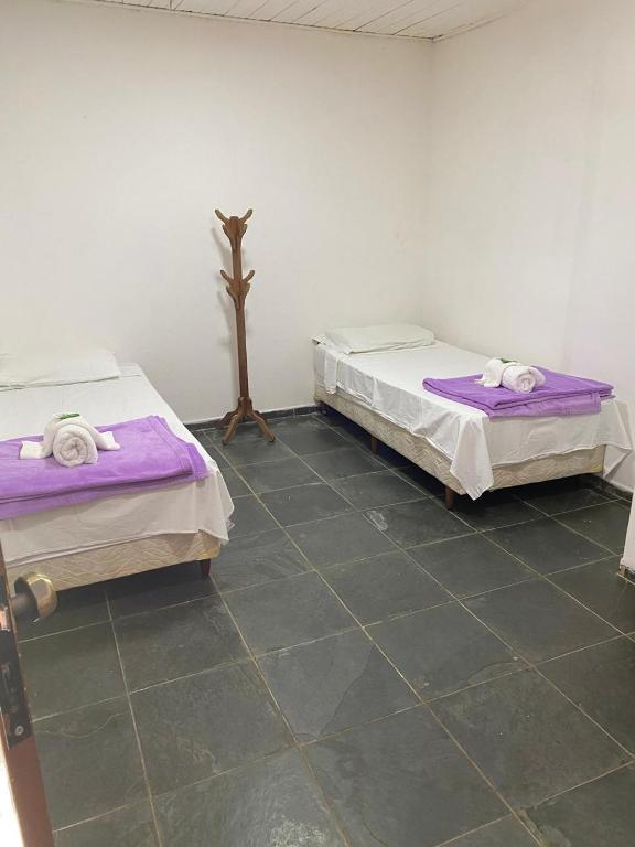 Postel nebo postele na pokoji v ubytování POUSADA PALIPALAN