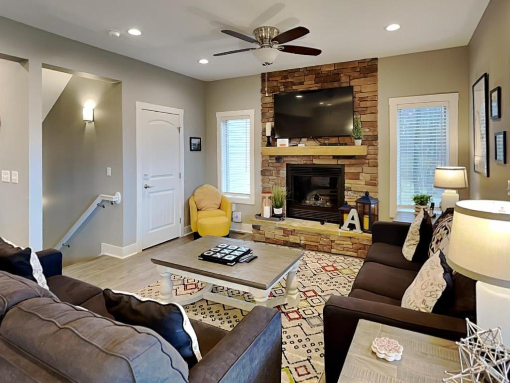a living room with a couch and a fireplace at Alla Famiglia in Oakland