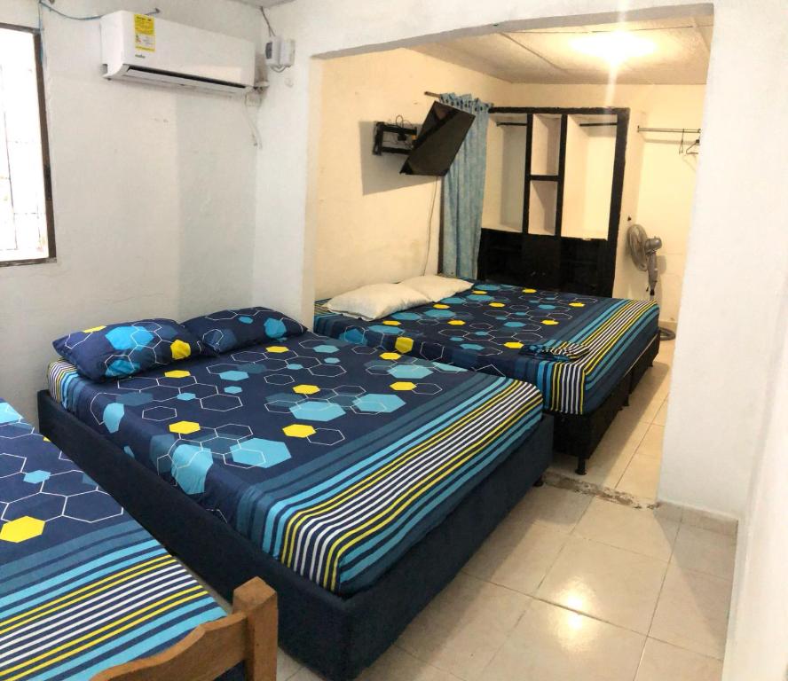 Postel nebo postele na pokoji v ubytování Casa Santorini II
