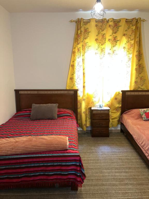 Katil atau katil-katil dalam bilik di Appartement beau et familial connecté
