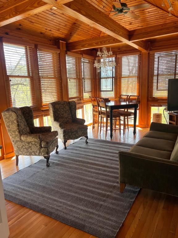 a living room with a couch and chairs and a table at Downtwn Crystal Terrace Piedmont in Eureka Springs