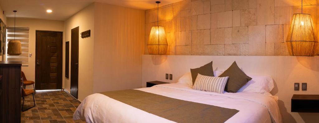 Postel nebo postele na pokoji v ubytování Traspatio Hotel Boutique