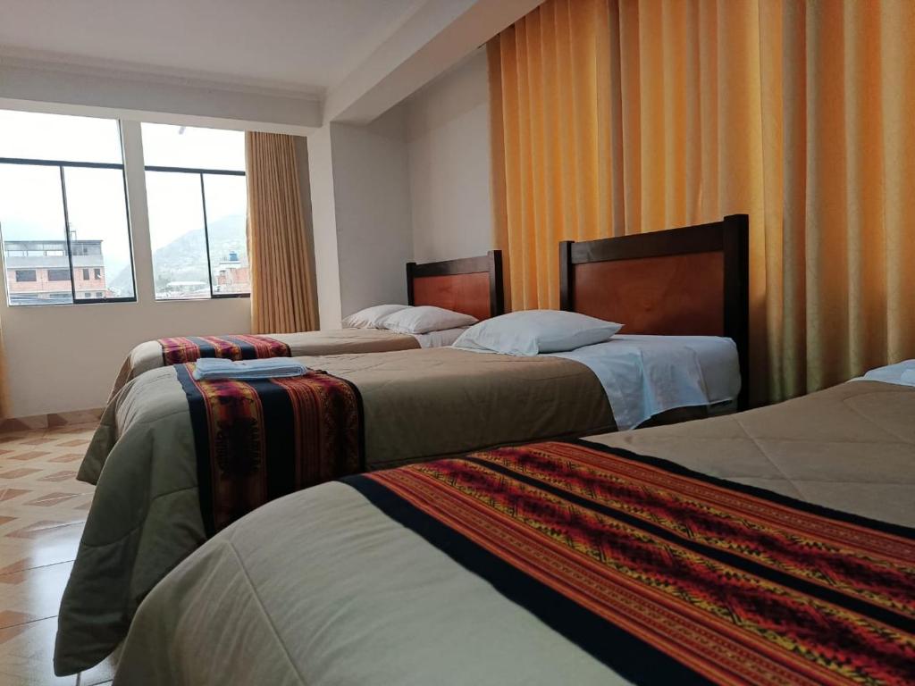 เตียงในห้องที่ Hotel Montaña White villasol