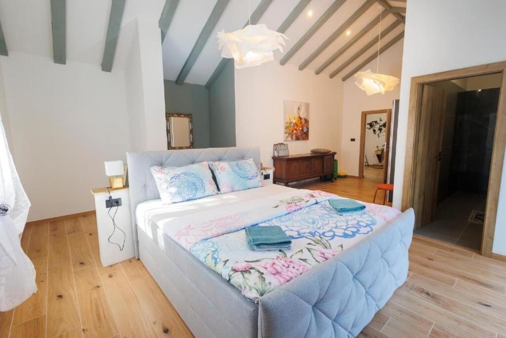 a bedroom with a large bed in a room at Villa Andrea in Zagvozd