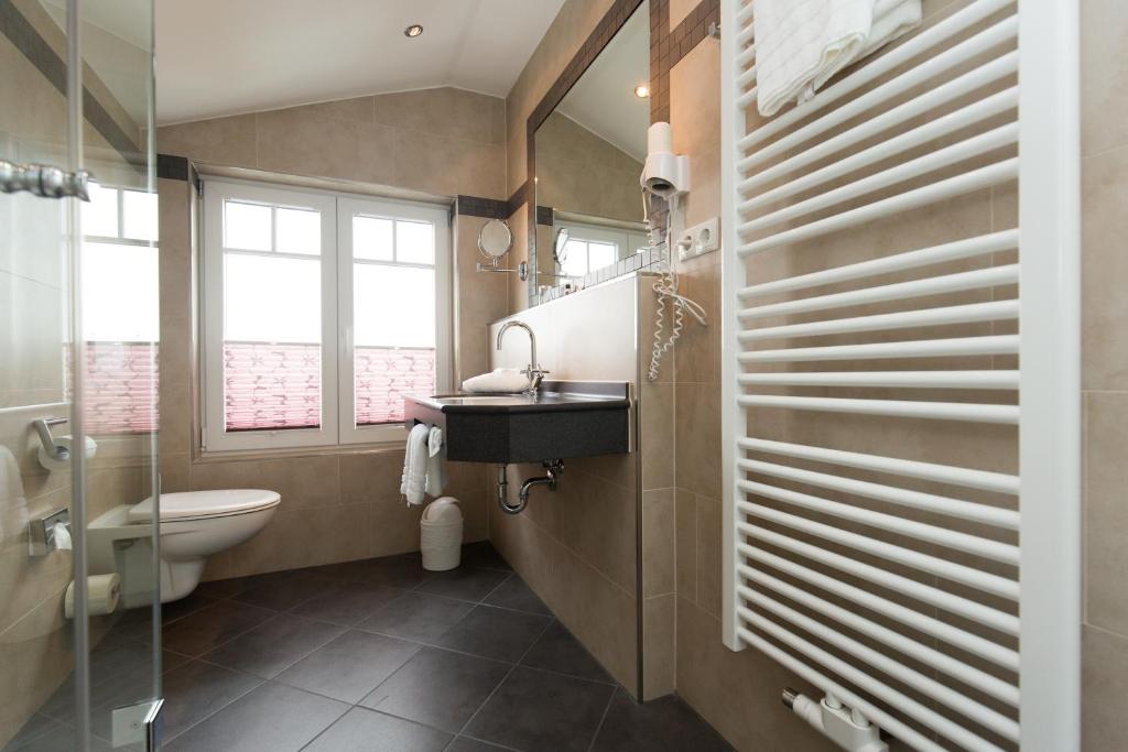 Koupelna v ubytování Hotel Sylter Blaumuschel