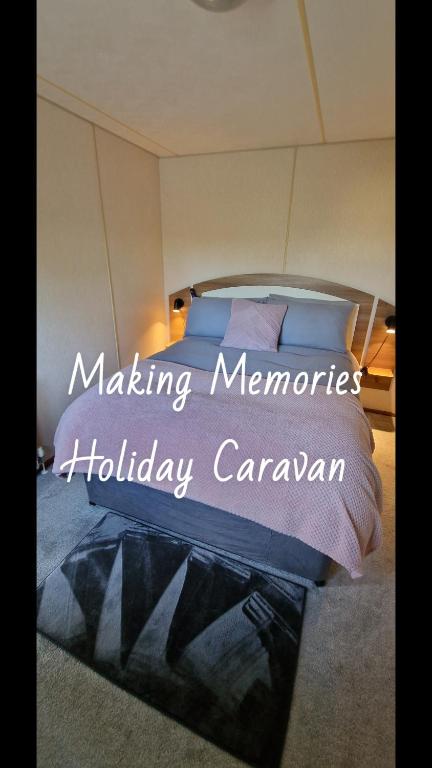 a bedroom with a bed with the words making memories holiday caragan at Making Memories Holiday Caravan in Skegness