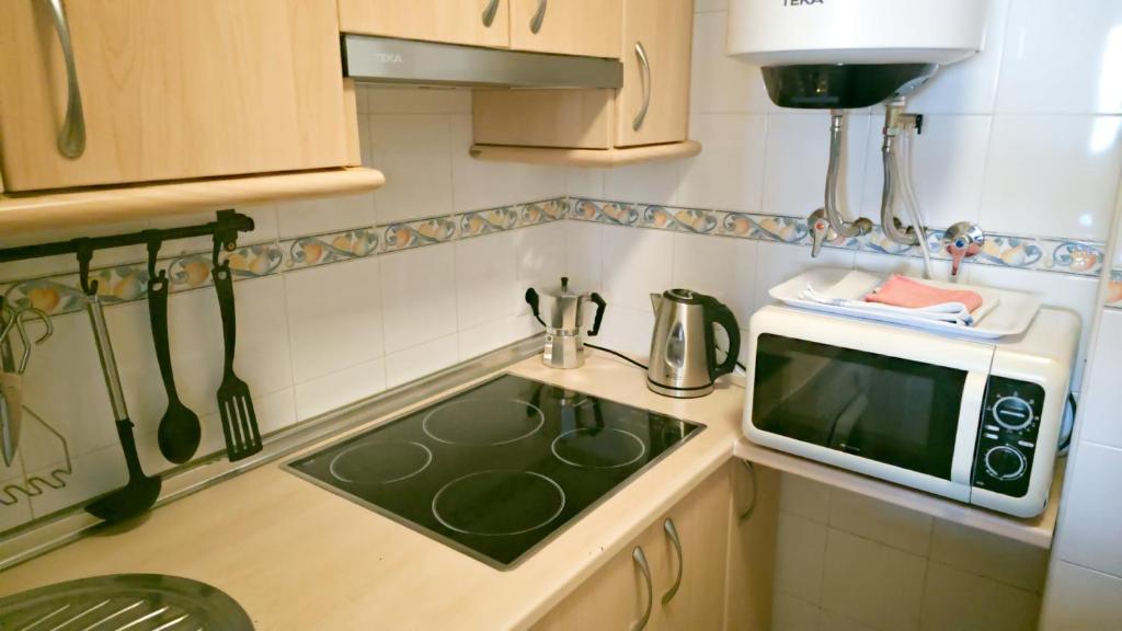 Kuchyň nebo kuchyňský kout v ubytování Apartamento Marion