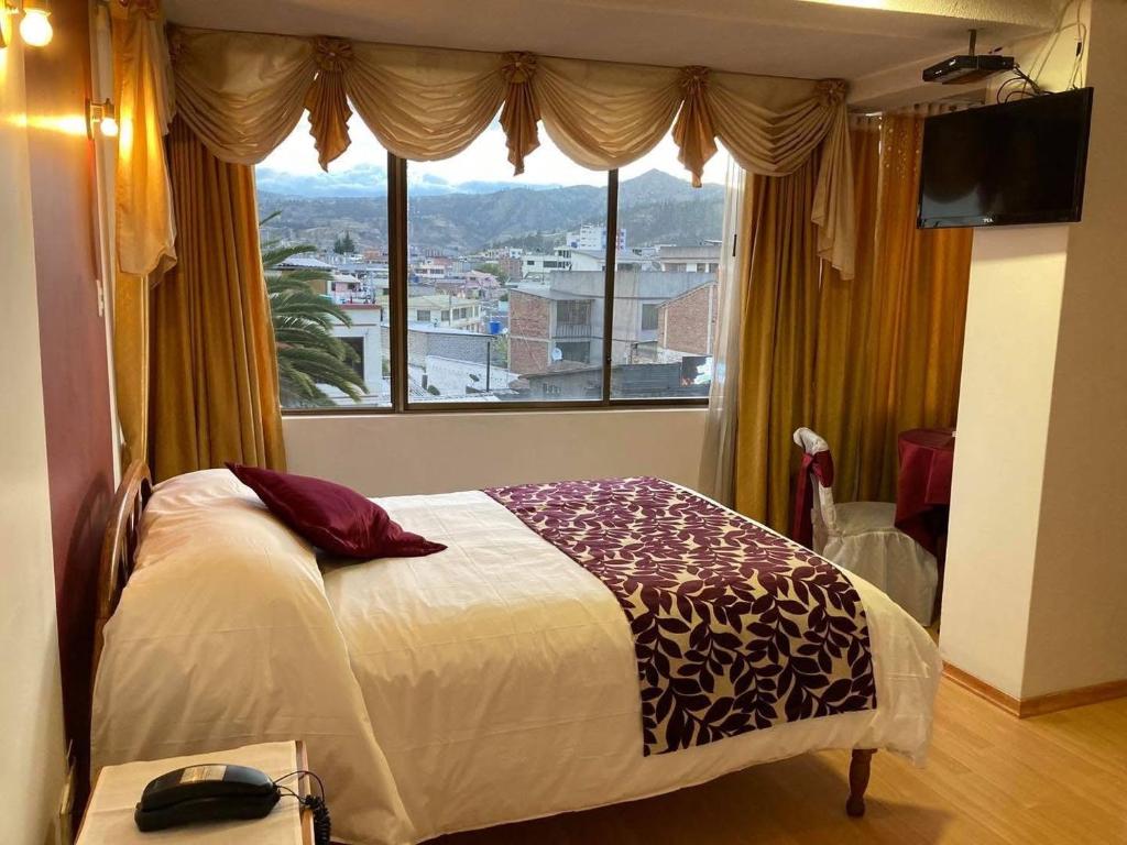 Postel nebo postele na pokoji v ubytování Hotel El Cisne Internacional