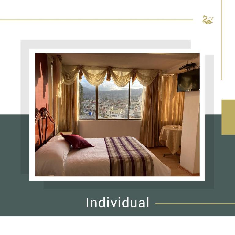 Postel nebo postele na pokoji v ubytování Hotel El Cisne Internacional