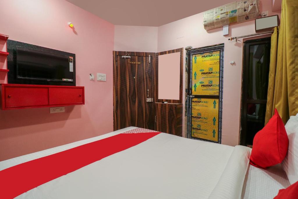 Postel nebo postele na pokoji v ubytování Collection O NEOSTAY TOWN HOUSE