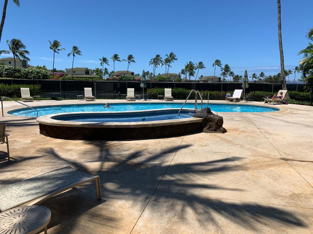 a large swimming pool with a pool at Lanai Villas in Koloa