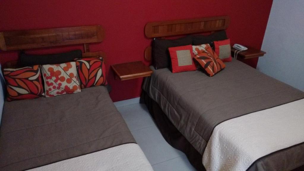 Postel nebo postele na pokoji v ubytování Hotel Pastora